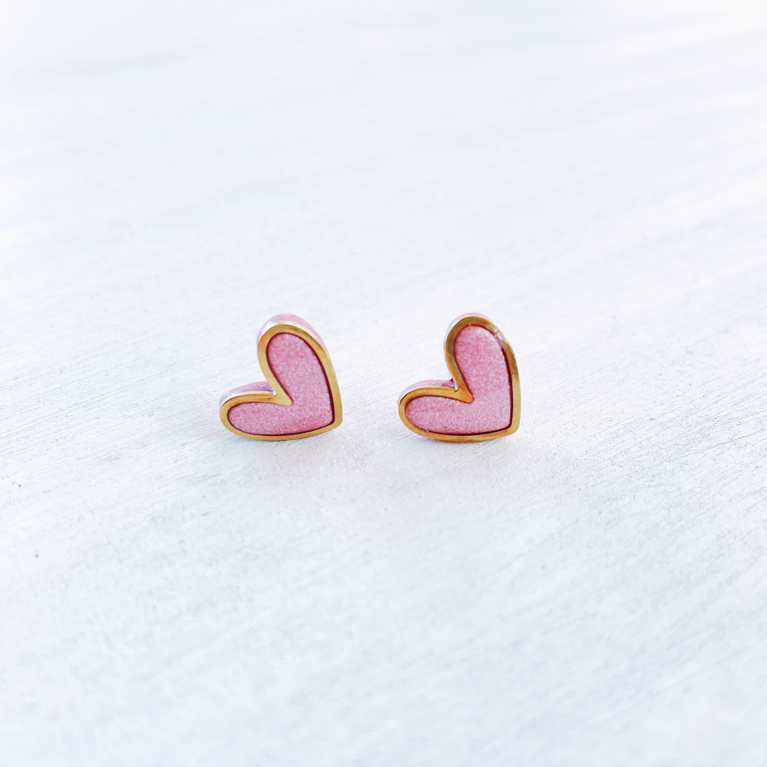 Light pink with gold accent polymer clay heart studs