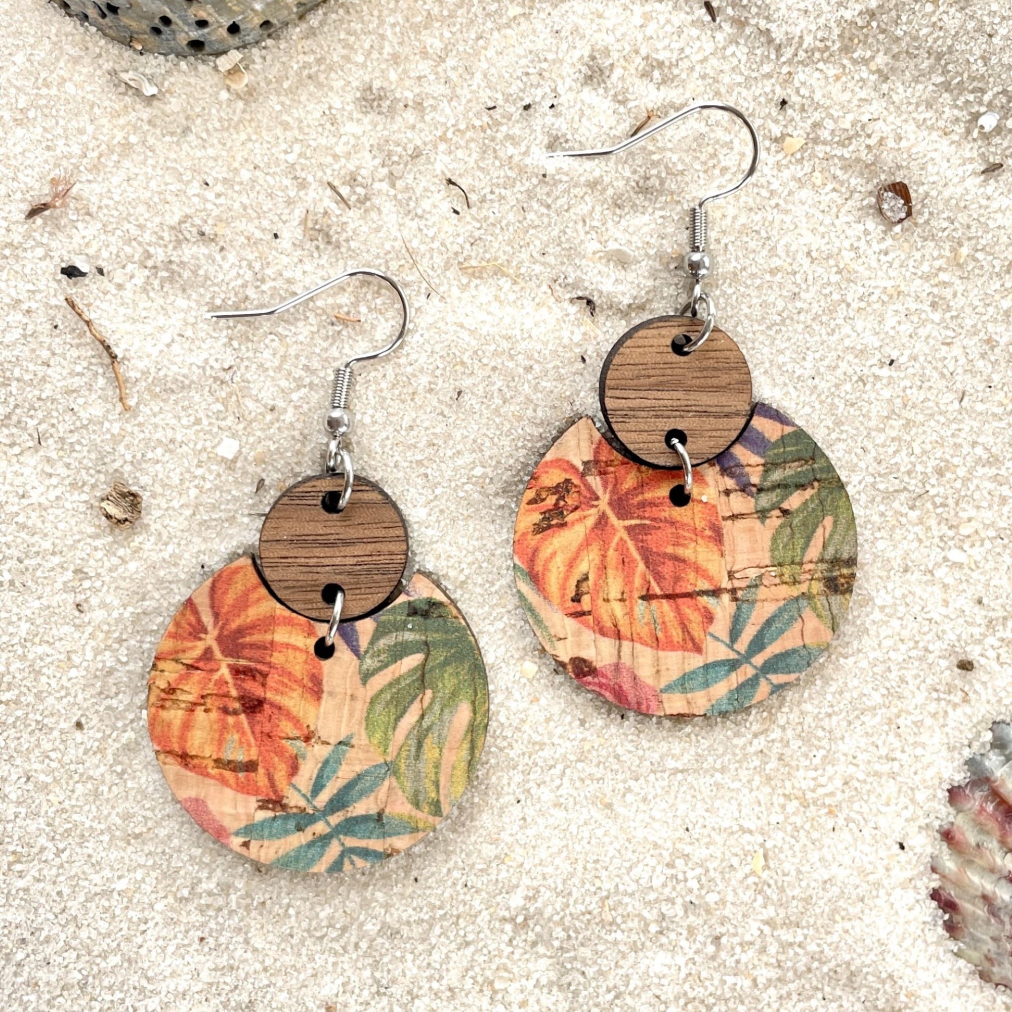 Cora cork and wood earrings in painted canopy pattern on sand background no card