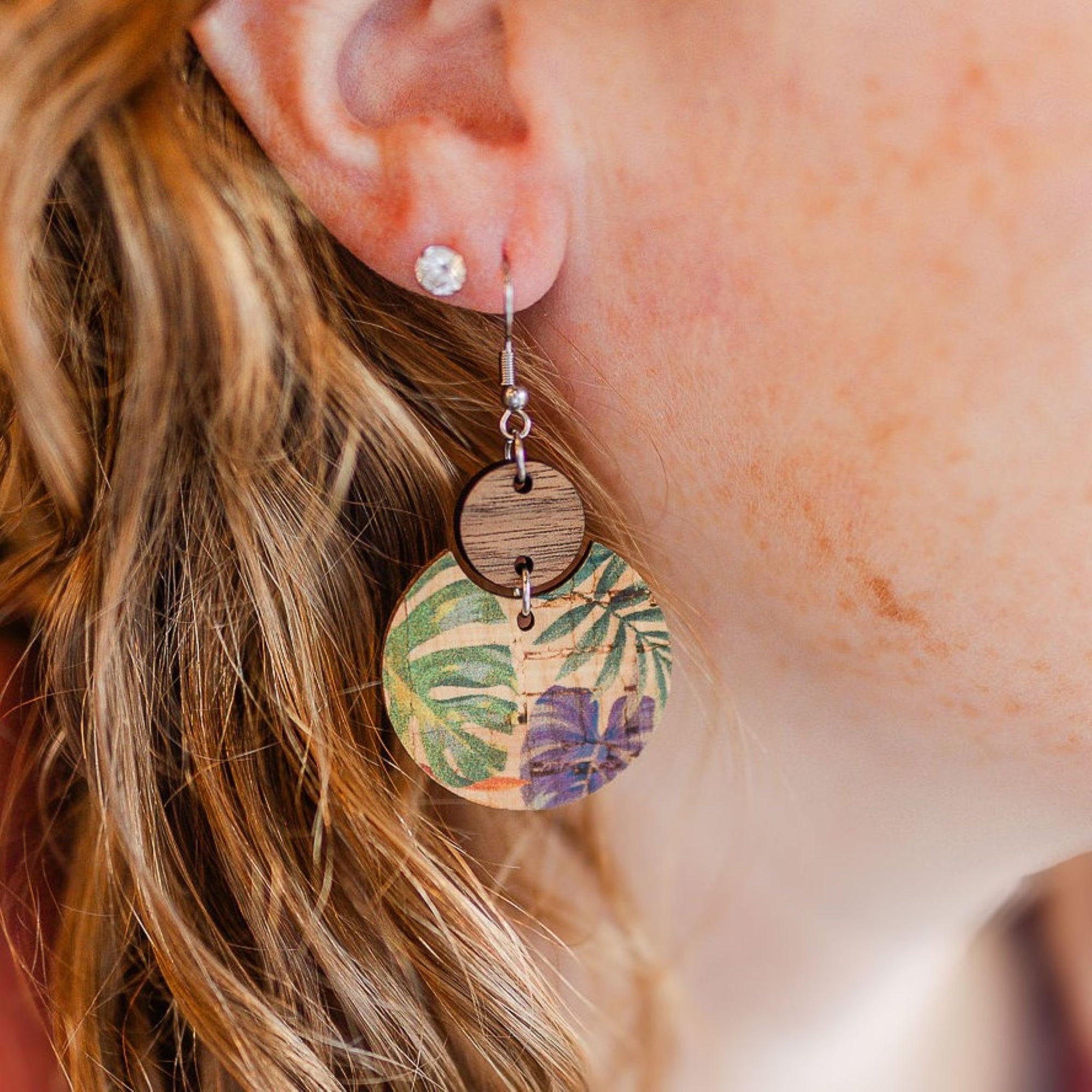 cora cork and wood earrings in painted canopy pattern close up on ear