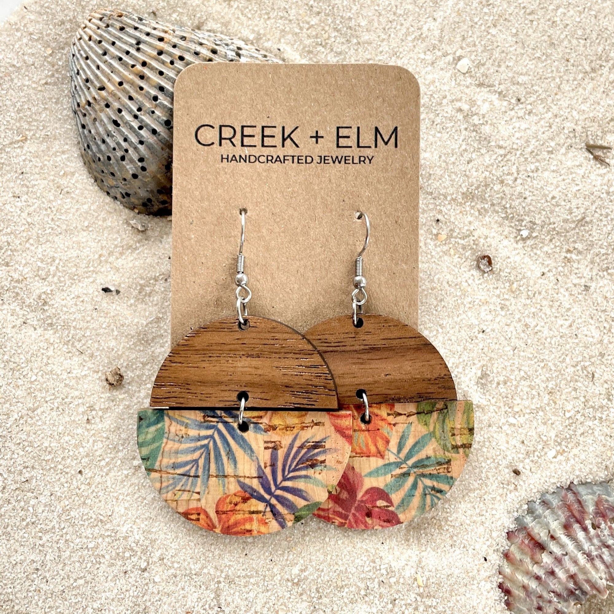 everly painted canopy cork and wood earrings on sand with seashells