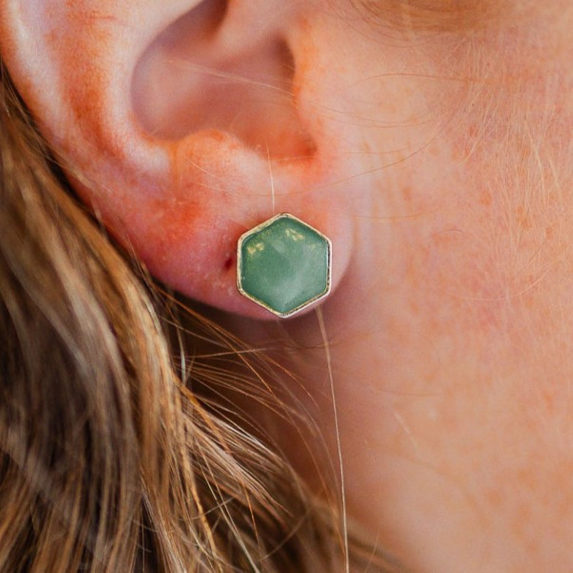 clay hexagon studs green onyx closeup on ear