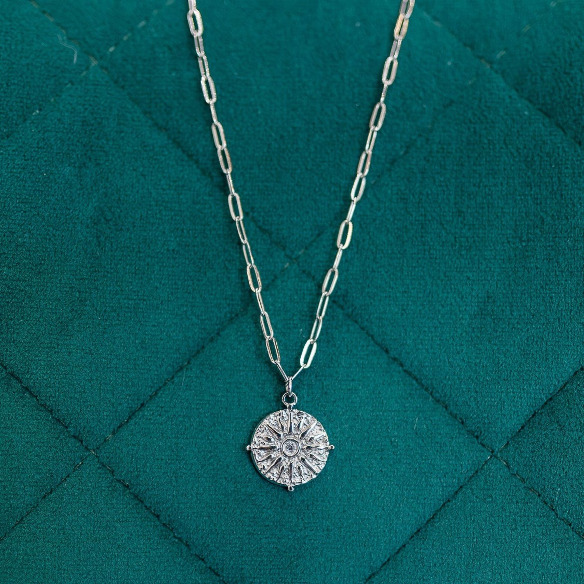 journey stainless steel silver necklace on deep green background