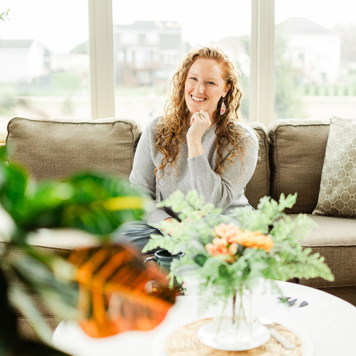 Woman wearing the Eliza Summer Garden cork teardrop earrings 