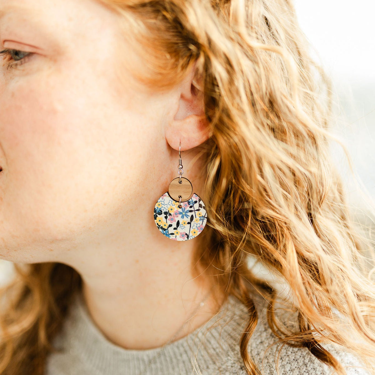 Close up look of the Cora heirloom floral cork and walnut earrings 