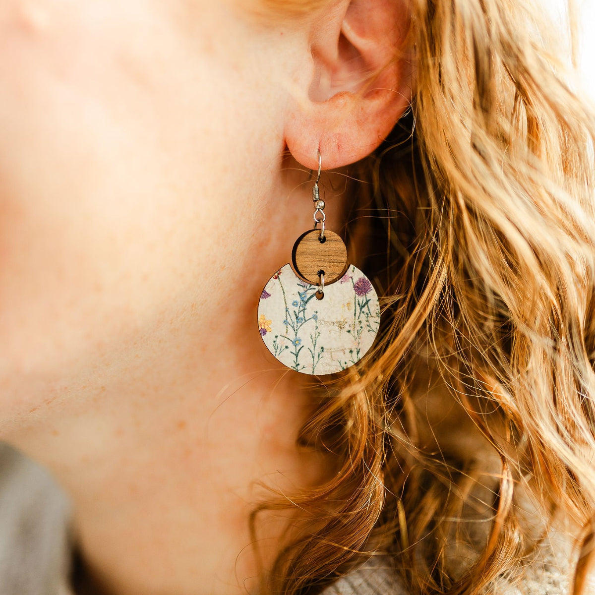 Wildflower cork and walnut earrings with soft floral detail on packaging
