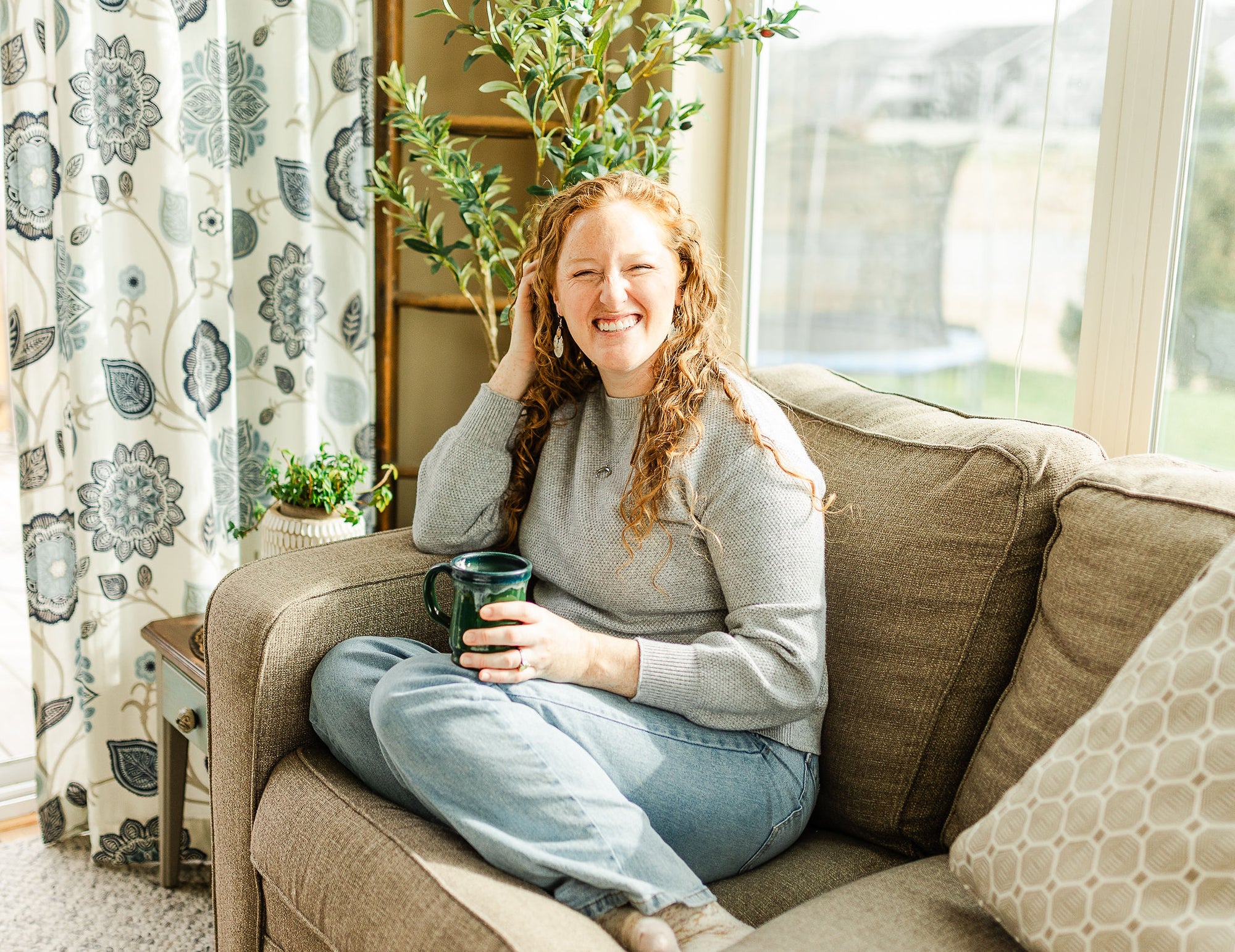 Woman wearing the Wildflower cork and walnut earrings