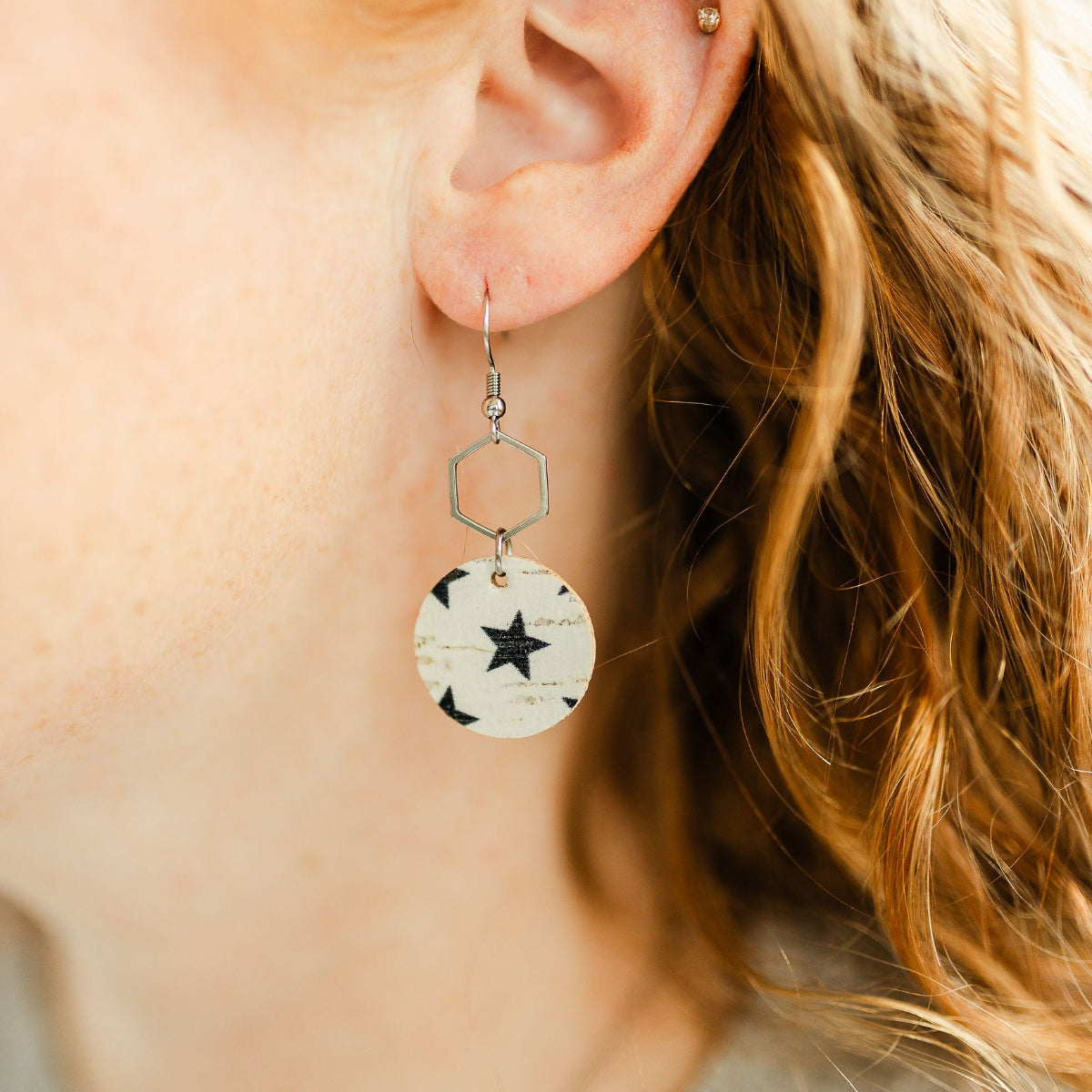 Silver Elizabeth blue stars cork hexagon earrings on ear