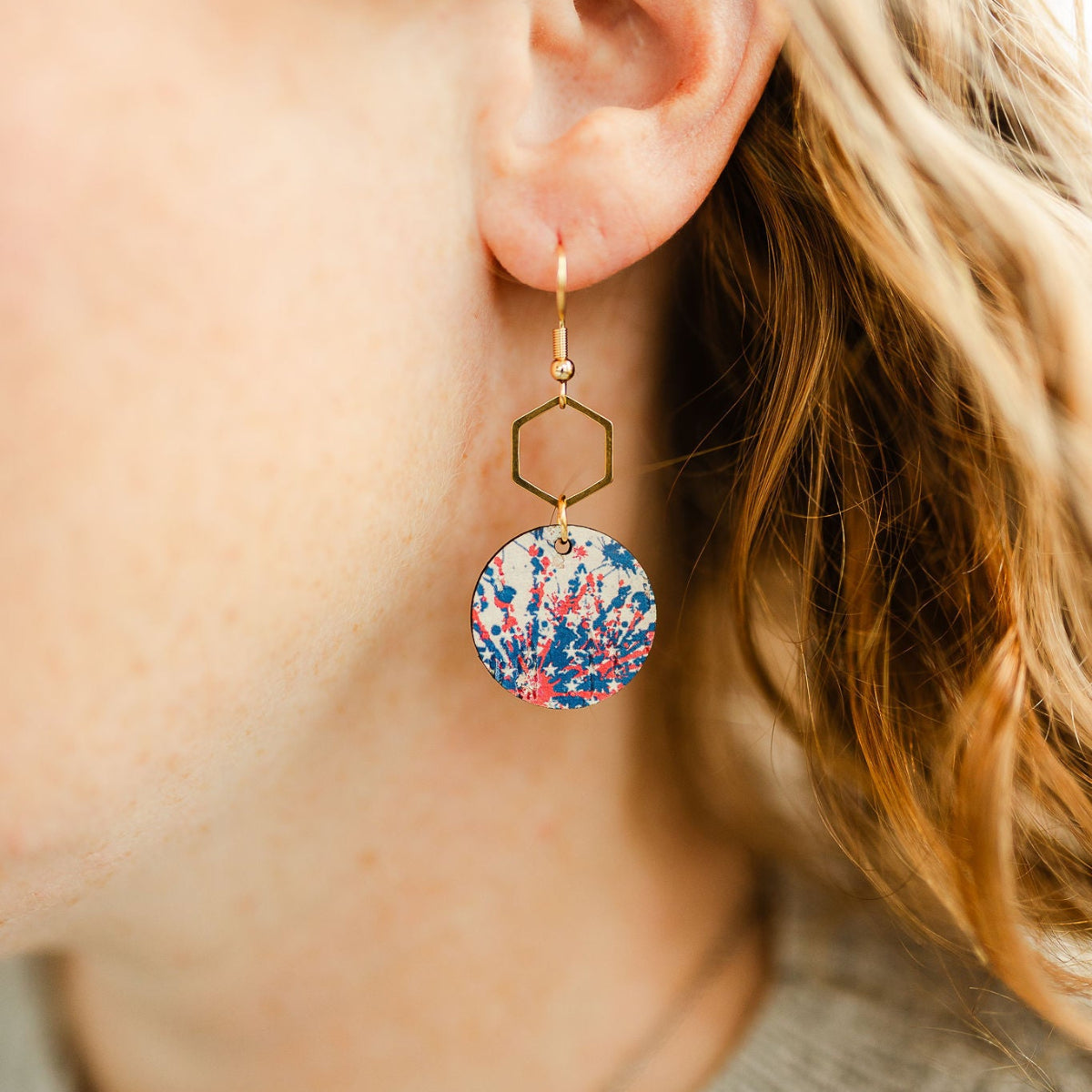 Close up look of the Gold Elizabeth star spangled cork and hexagon earrings 