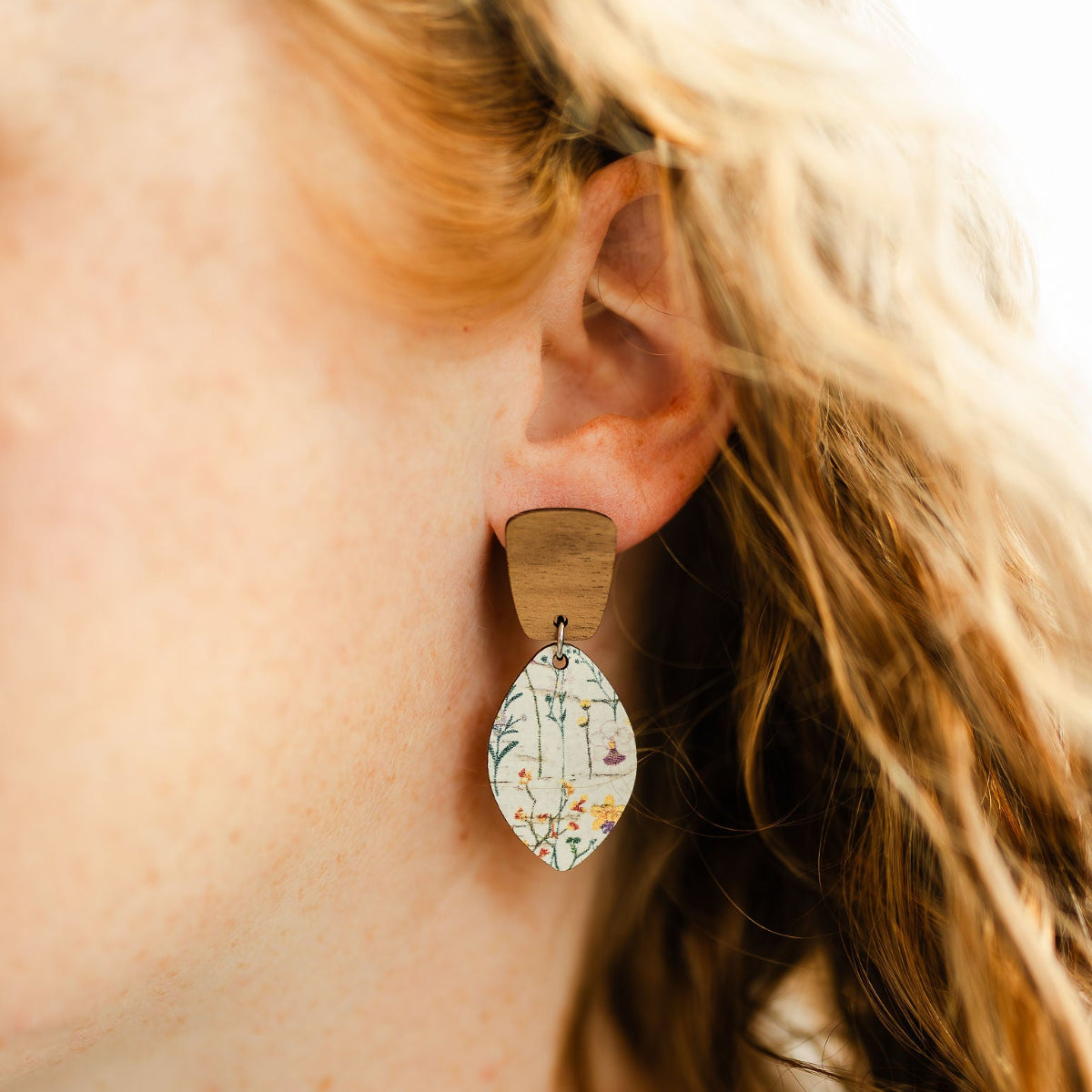 Close up loo of the Wildflower cork and walnut leaf earrings