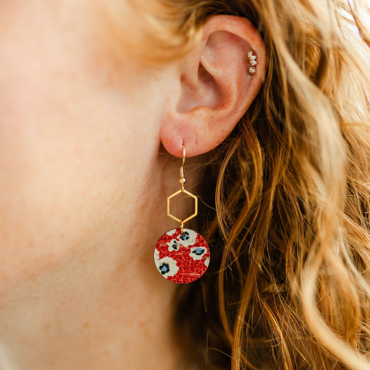 Close up of Elizabeth fireworks cork hexagon earrings 