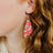 Close up shot of an earring worn on one ear