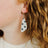 Close up shot of an earring worn on ear
