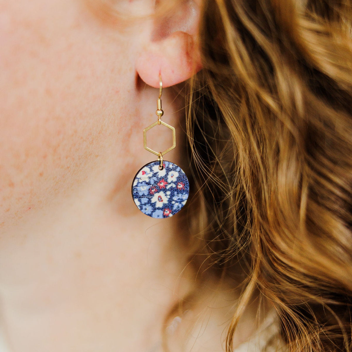 Close up shot of the Gold Elizabeth worn on ear