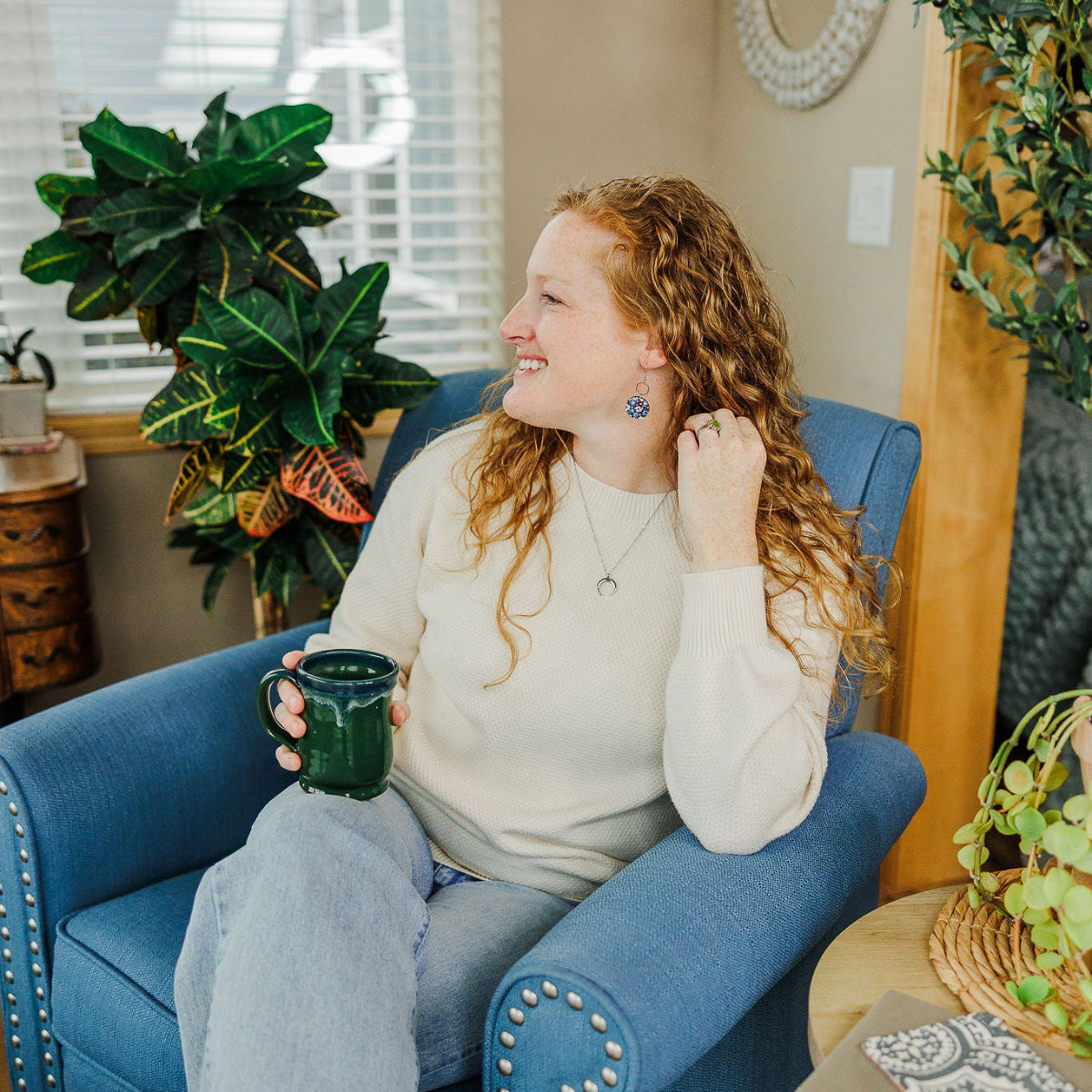 Woman showcasing the Creek+Elm earrings