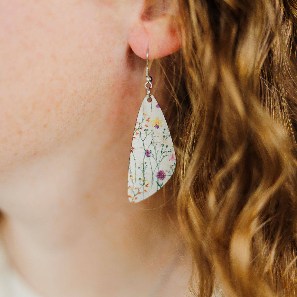 Close up shot of an earring worn on one ear