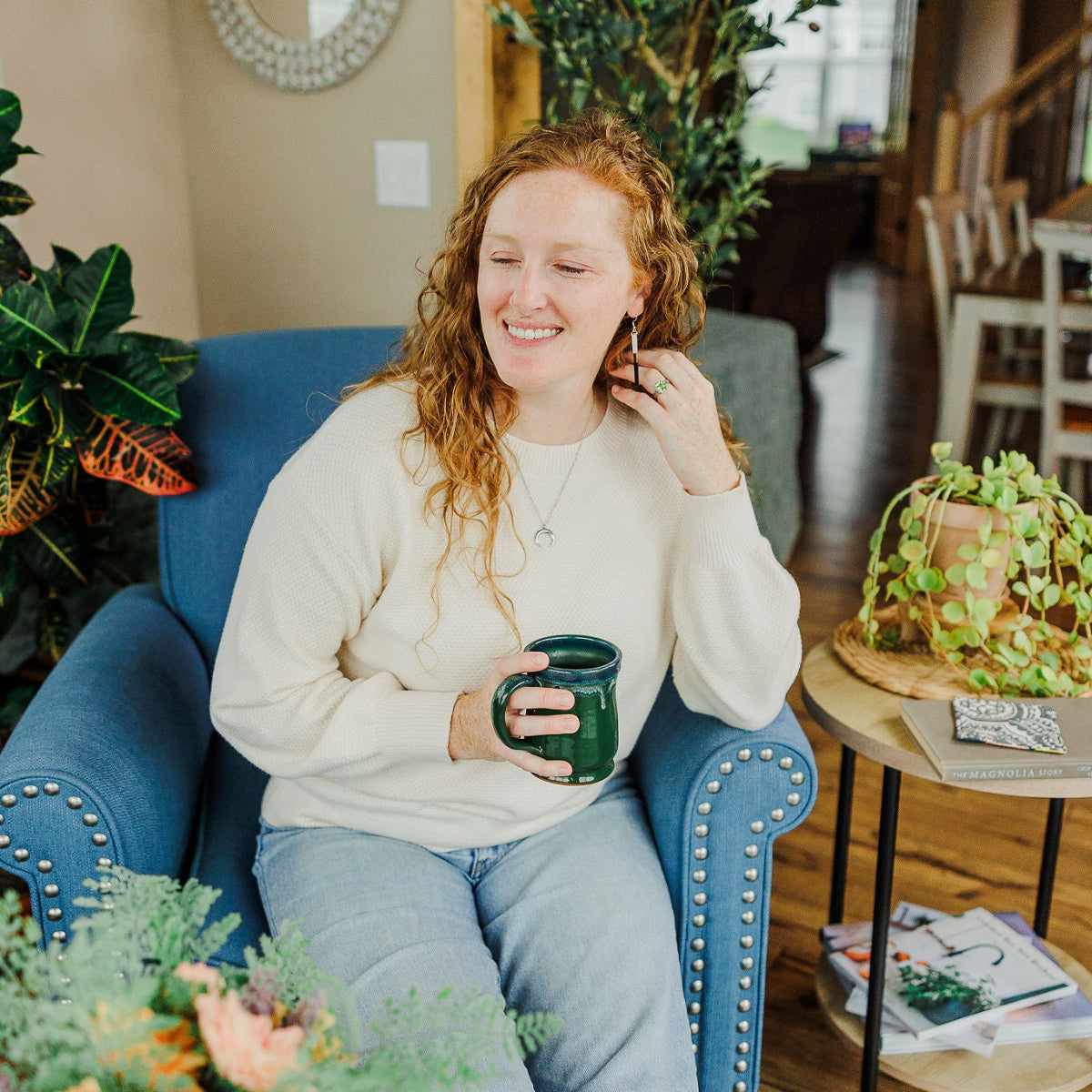 Woman on a couch holding a mug