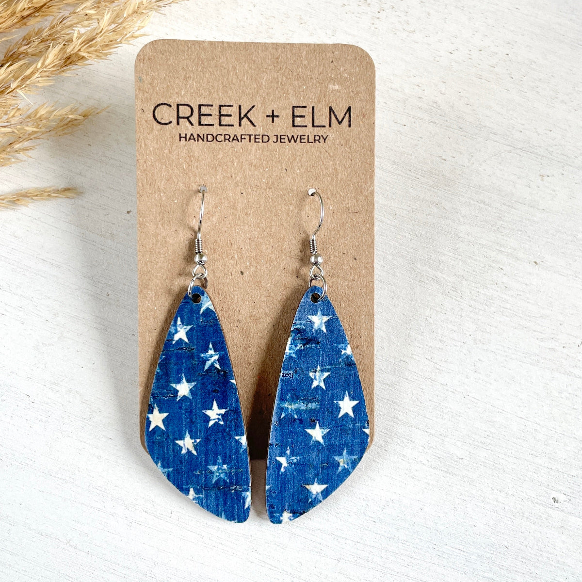 Eliza Denim Stars cork teardrop earrings on packaging 