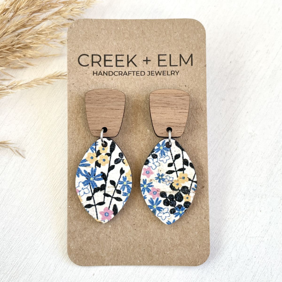 Lightweight leaf-shaped cork and walnut earrings with floral pattern