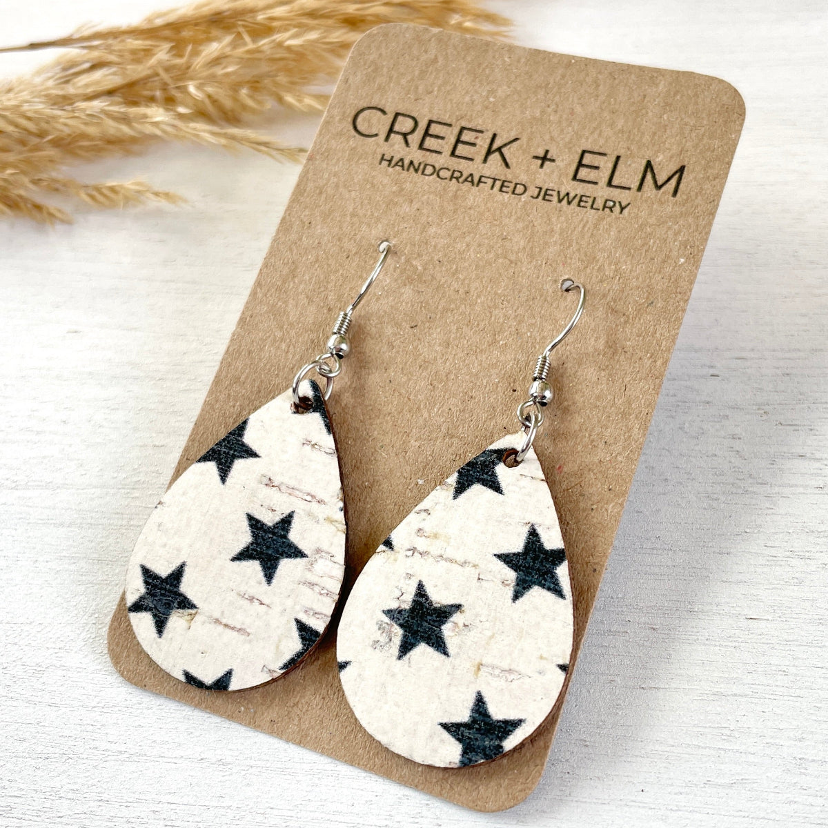 Blue stars cork teardrop earrings lightweight on packaging