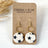 Gold Elizabeth blue stars cork hexagon earrings on Creek+Elm Packaging