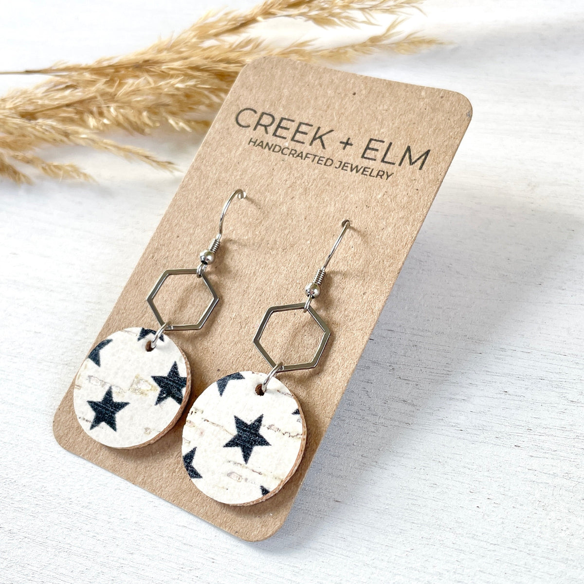 Silver Elizabeth blue stars cork hexagon earrings on Packaging