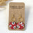 Gold Elizabeth fireworks cork hexagon earrings on Creek+Elm Packaging