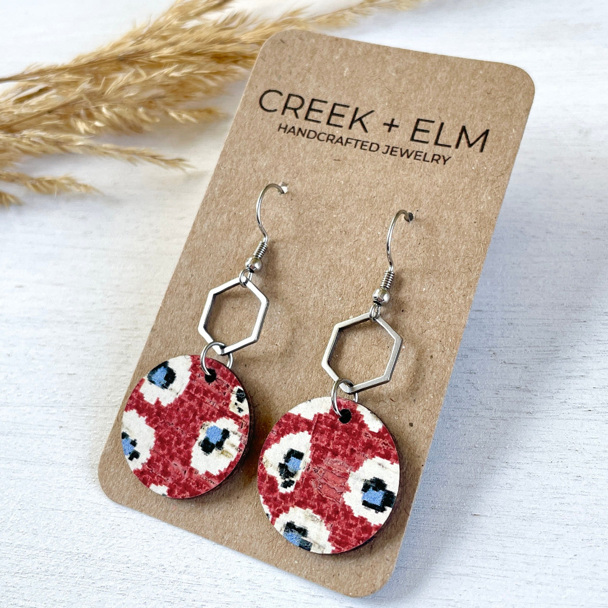 Silver Elizabeth fireworks cork hexagon earrings on Packaging