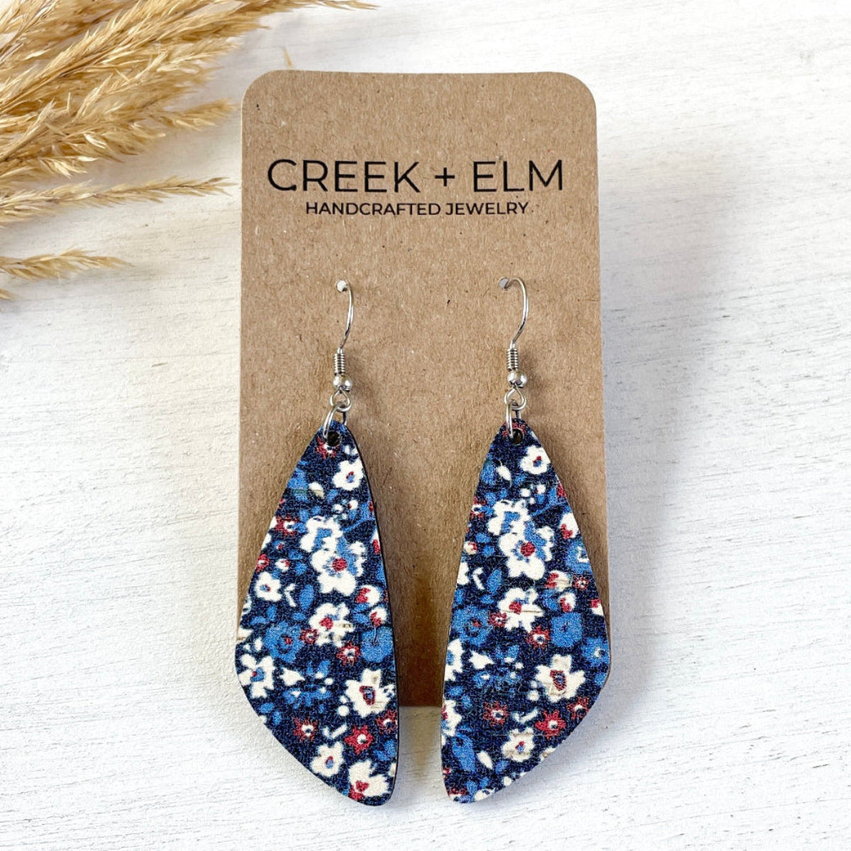 Eliza Patriotic Poppies cork teardrop earrings on plain background