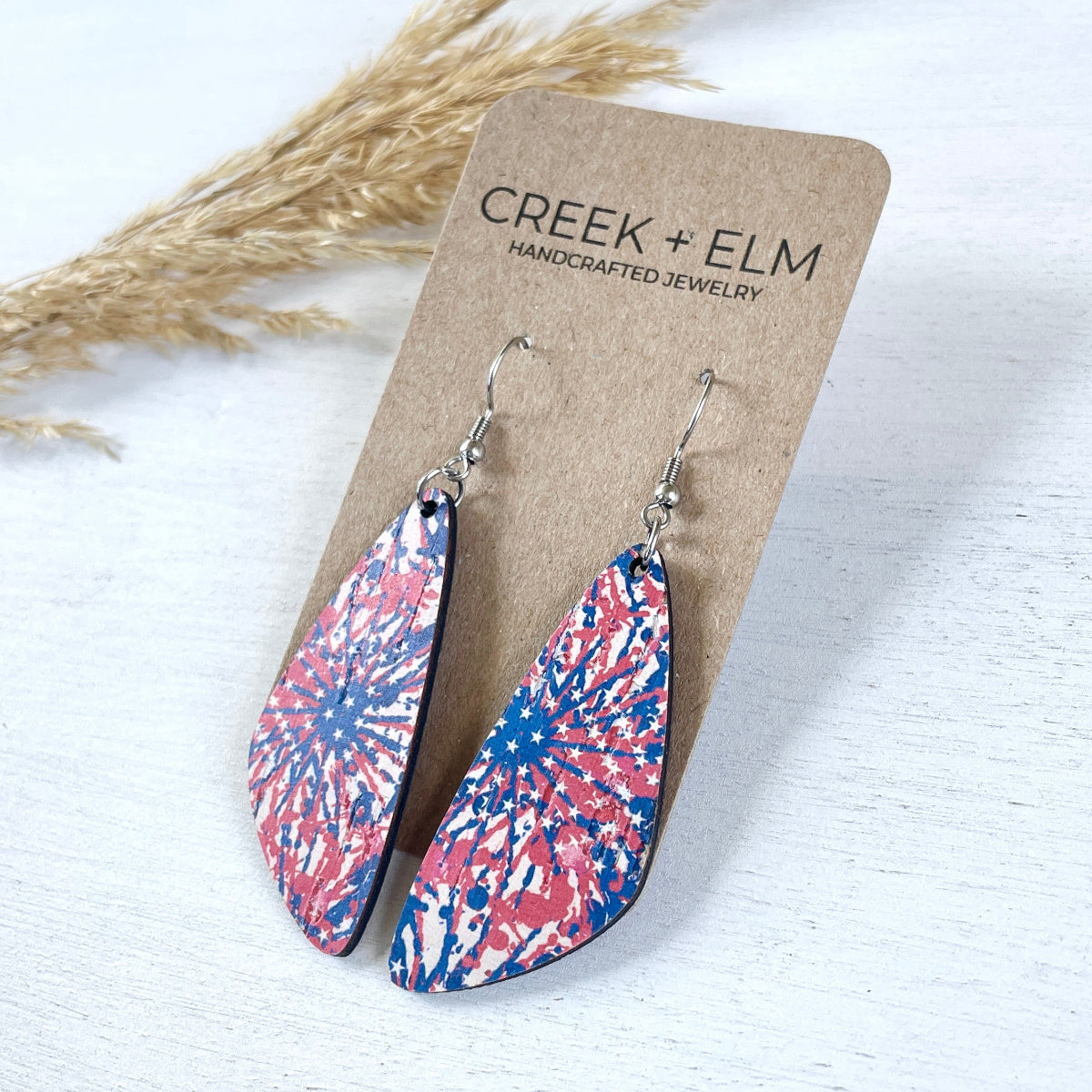 Silver  Eliza Star Spangled cork teardrop earrings on Packaging