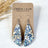 Eliza blue floral cork teardrop earrings on Creek+Elm Packaging
