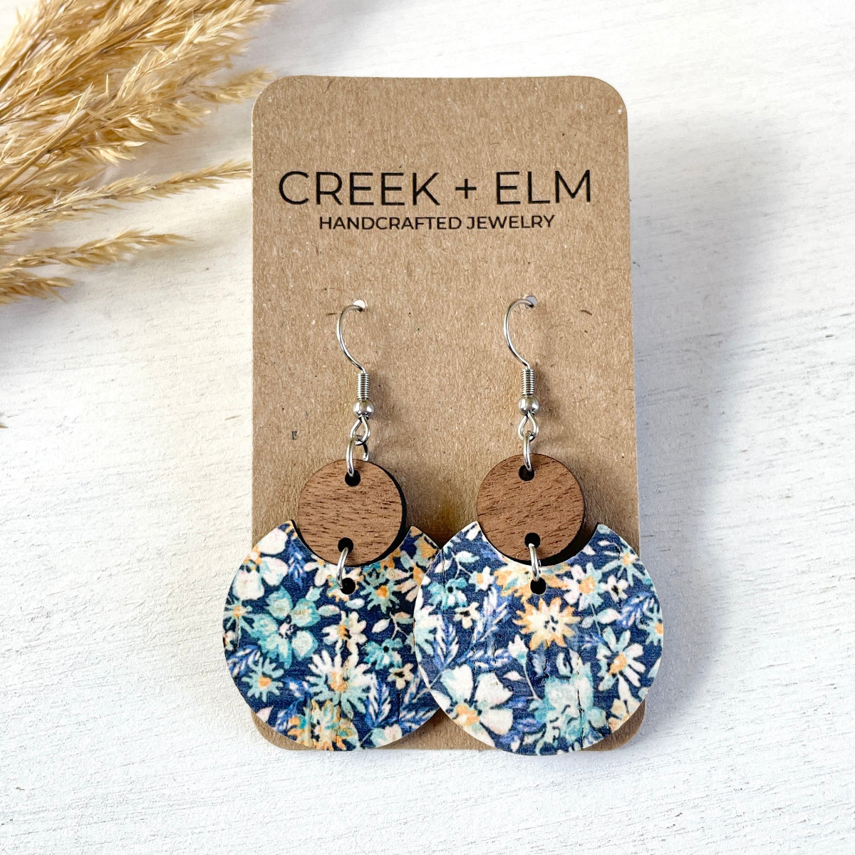 Cora Blue Floral cork and walnut earrings with a different pattern on cork