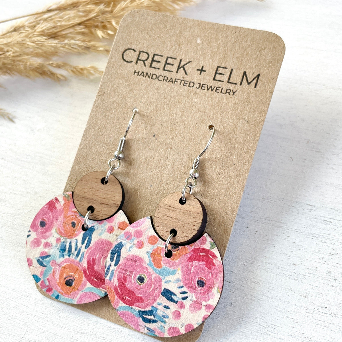 Side view of the Cora Summer Garden cork and walnut earrings on Creek+Elm Packaging