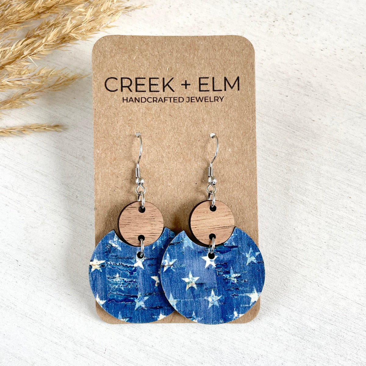 Cora Denim Stars cork and walnut earrings on white background