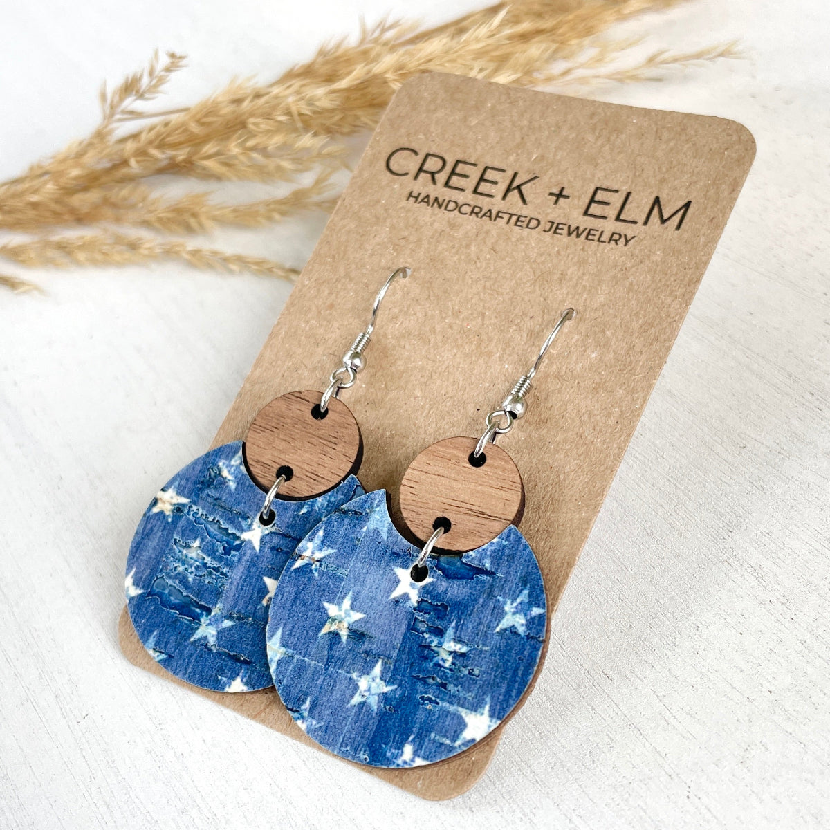 Side view of the Cora Denim Stars cork and walnut earrings 