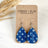 Mini Silver Kendra Denim Stars cork teardrop earrings on Packaging 