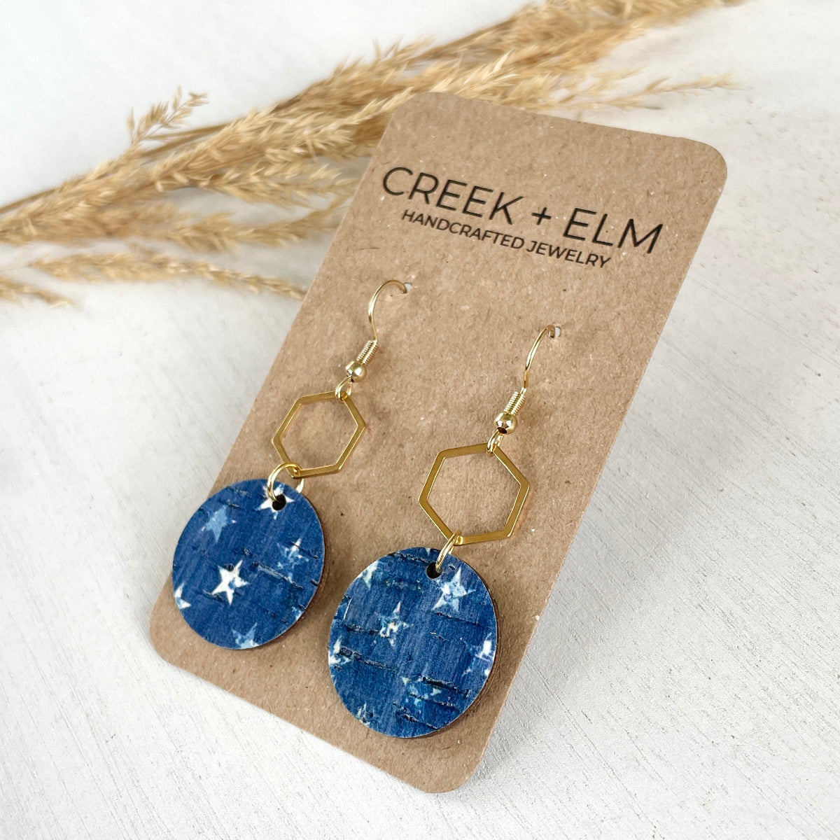Gold Elizabeth Denim Stars cork and hexagon earrings on Creek+Elm Packaging