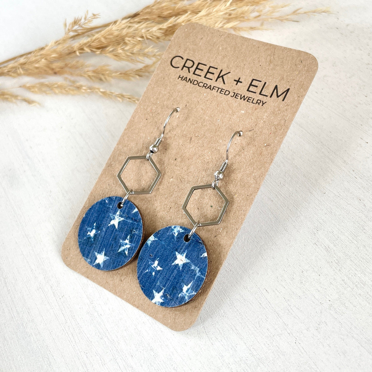 Silver Elizabeth Denim Stars cork and hexagon earrings on Creek+Elm Packaging