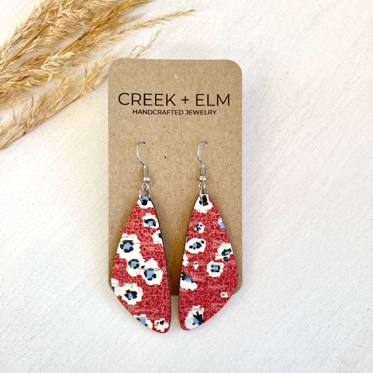 Playful firework-inspired earring on a packaging