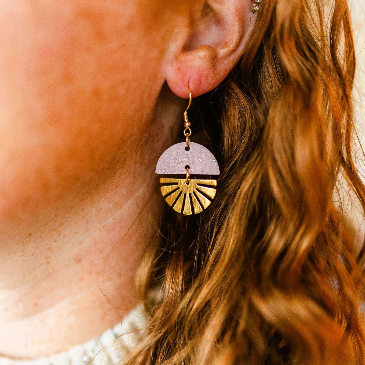 claire-golden-starburst-blush-pink-earrings on packaging 