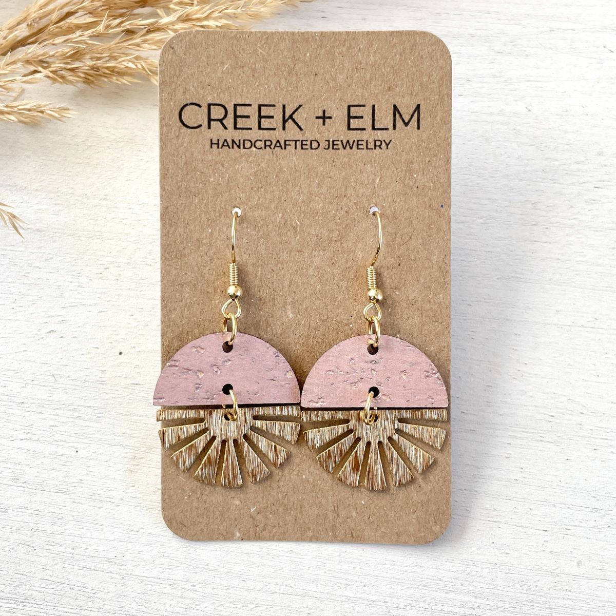 claire-golden-starburst-blush-pink-earrings on packaging 