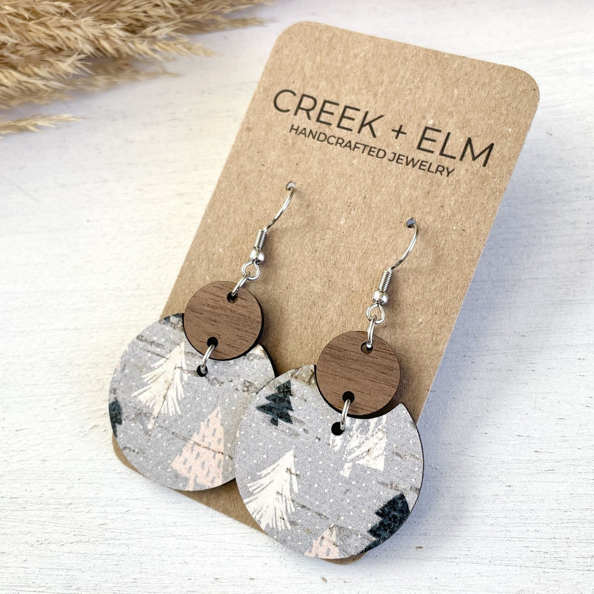 side angle of cora cork and walnut christmas tree earrings
