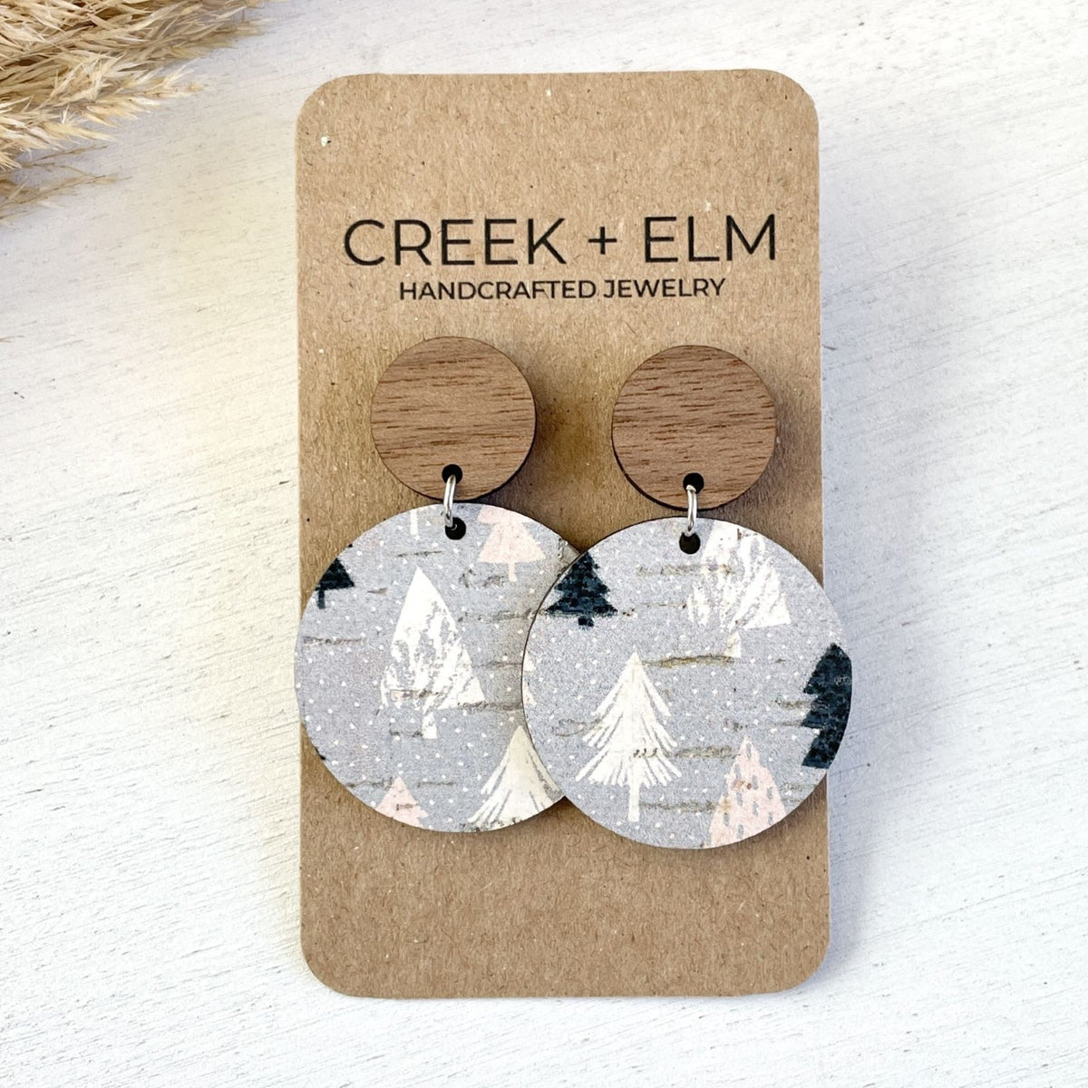 liyra walnut stud with a patterned cork circle in a fun woodsy pattern