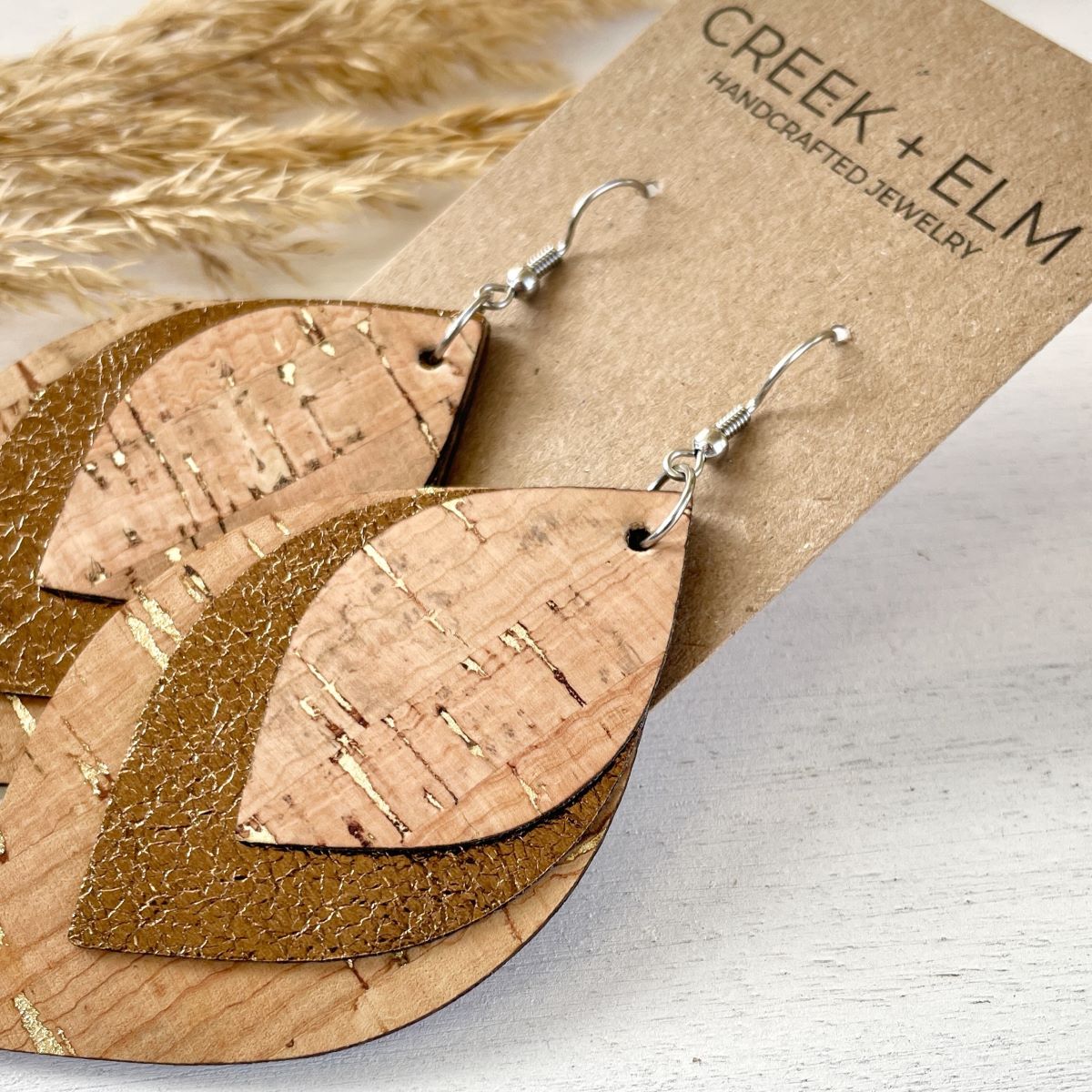 Macy natural cork leaf earrings with gold flecks and layered vegan leather design with random different pattern each